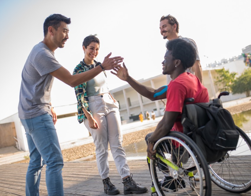Friends with one in wheelchair